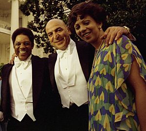 Willie Mays, Telly Savalas, Mae Louise Allen Mays, and Others Waiting in the Receiving Line Prior to a State Dinner Honoring Queen Elizabeth II of Great Britain - NARA - 45644163 (cropped)