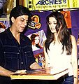 Shah Rukh Khan views a book with Aishwarya Rai in 2002