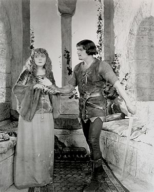 Fairbanks Robin Hood giving Marian a dagger