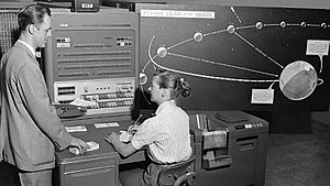 Human computer with IBM 704 in 1959