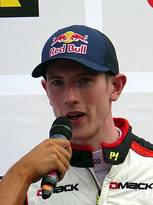 Elfyn Evans smiling in his racing gear