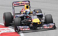 Sebastian Vettel driving the Red Bull RB7: "Kinky Kylie" (2011)