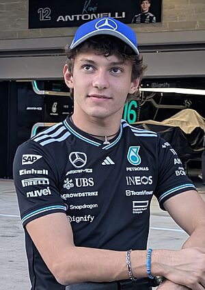 Antonelli smiling outside his pit garage in Mercedes team apparel at the 2025 United States Grand Prix