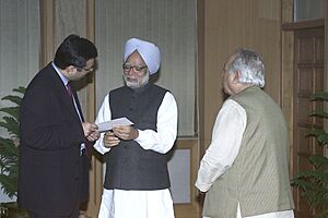 Shri R.P. Goenka and Shri Sanjiv Goenka of RPG Enterprises presenting a cheque of Rs. 1 crore to the Prime Minister, Dr. Manmohan Singh, towards the Prime Minister's National Relief Fund in New Delhi on January 17, 2005.jpg