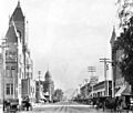Street view in San Bernardino, California, includes courthouse, ca.1905 (CHS-8547) (16475726449) (cropped)