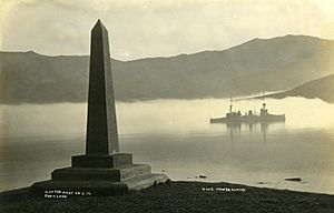 The HMS 'NZ' in Akaroa Harbour with the Britomart Monument in the foreground (14576932958)