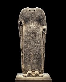 Buddha draped in robes portraying the Realms of Existence