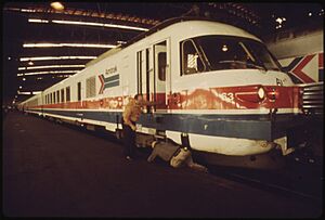 LAST MINUTE CHECK OF THE ENGINE OF THE AMTRAK TURBOLINER PASSENGER TRAIN IS MADE BEFORE DEPARTURE FROM ST. LOUIS... - NARA - 556059