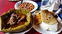 Luwombo served with matooke, posho and chapatti.jpg