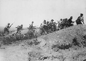 Scene just before the evacuation at Anzac. Australian troops charging near a Turkish trench. When they got there the... - NARA - 533108