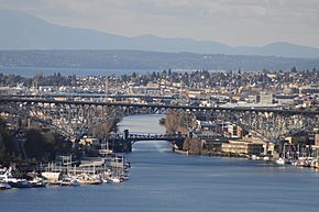 The Fremont Cut of the Lake Washington Ship Canal, seen from the grounds of the St. Mark's Episcopal Cathedral complex, across Lake Union