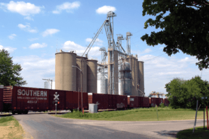A freight train passing State Line's grain elevators