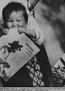 1940 govt photo minnesota farming scene chippewa baby teething on magazine indians at work