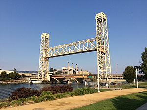 View of a vertical lift bridge spanning the estuary separating Oakland from Alameda.