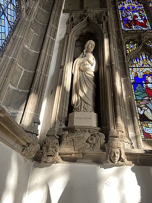 Interior of St Margaret's Church, Leicester - St Margaret of Antioch statue in chancel