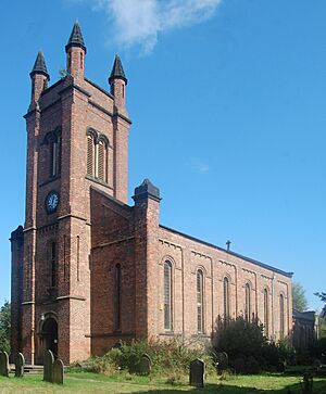 red brick church with tall clock tower
