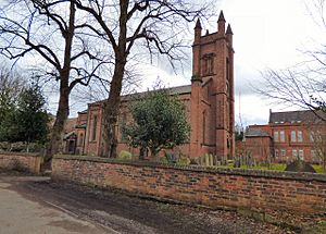 red brick church with tall clock tower