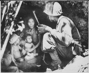 "A member of a Marine patrol on Saipan found this family of Japs hiding in a hillside cave. The mother, four children an - NARA - 532380