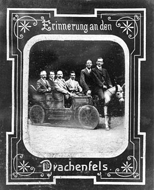 Frederick Stratton, John William Nicholson, K. Schwarzschild, Frank Watson Dyson ride in automobile