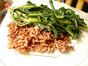 Plate of Wehani rice with sauteed dandelion greens