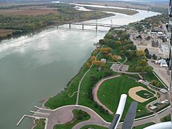 Yankton (right) along the Missouri River with the Meridian Bridge connecting Nebraska, looking west.