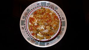 Buljol (Salted cod, oil, onions, tomatoes, pepper, boiled eggs).jpg