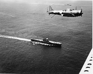 Douglas SBD flies over USS Enterprise (CV-6) and USS Saratoga (CV-3) on 19 December 1942
