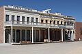 Photograph of the Big Four House in Old Sacramento, with signs "Central Pacific Rail Road Company", "Huntington & Hopkins", and "Hardware".