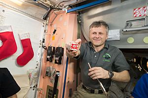 ISS-50 Andrei Borisenko with cookies at Christmas Eve