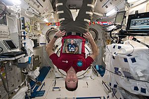 ISS-50 Thomas Pesquet poses with a photo of Timothy Peake in the Kibo lab