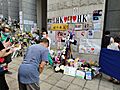 Middle-aged man paying his respect to Elizabeth II outside the British Consulate-General Hong Kong