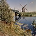 Vergezicht met molen en houten loopbrug - Sint Pancras - 20364304 - RCE
