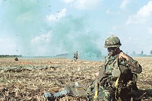 DF-ST-82-06464 Troops from the 82nd Airborne Division are dropped by parachute during exercise Reforger '80