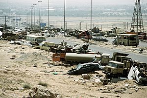 Demolished vehicles line Highway 80 on 18 Apr 1991
