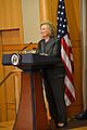 Clinton standing behind lectern