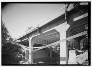 PERSPECTIVE ELEVATION LOOKING SOUTHEAST AT CHENOWETH CREEK BRIDGE. INSULATED POWERLINE STRUNG ACROSS FRONT. - Historic Columbia River Highway, Troutdale, Multnomah County, OR HAER ORE,26-TROUT.V,1-112