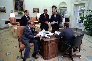 President Reagan holds a oval office staff meeting 1981