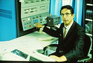 Robert Ledley posing with IBM 360