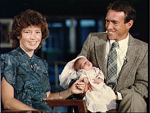 S83-39200 Astronauts Anna and Bill Fisher and baby daughter Kristen Ann
