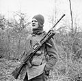 A member of No. 9 Commando at Anzio, equipped for a patrol with his Bren gun, 5 March 1944. NA12469