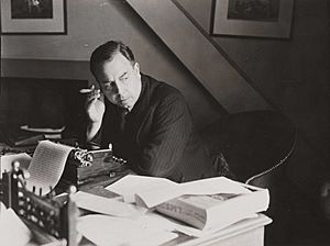 J. B. Priestley at work in the study at his home in Highgate, London