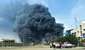 Smoke billowing from Shahid Rajaee port explosion, 26 April 2025 (flatter cropped)