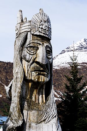 Totem in Valdez, Alaska with mountain background