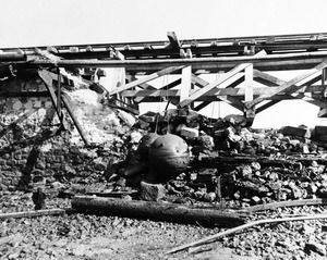 80-G-257404 , German mines lashed to railroad causeway