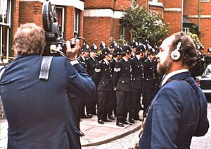 Cameraman and soundman filming police in Leicester, England, 1974