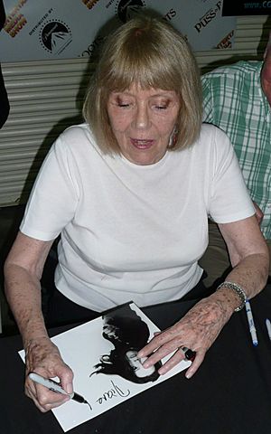 Diana Rigg signing an autograph in 2011