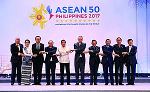 ASEAN leaders link arms during the 30th ASEAN Summit Opening Ceremony on April 29, 2017