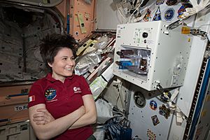 ISS-43 Samantha Cristoforetti waits next to the ISSpresso machine