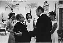 Photograph of President Gerald Ford and Mrs. Betty Ford chatting with President and Mrs. Giovanni Leone in the Yellow Oval Room at the White House