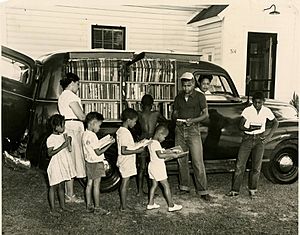 African-American children line up outside of Albemarle Region bookmobile